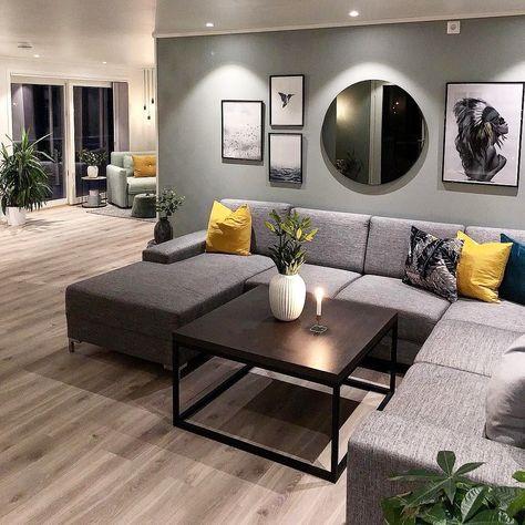 I like the arrangement of the picture frames and round mirror above the sofa. Mirrors Above Couch, Above Couch Decor, Wall Mirror Decor Living Room, Couch Wall Decor, Mirror Decor Living Room, Above Couch, Grey Couches, Gallery Wall Living Room, Couch Decor