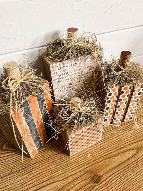 Easy DIY Pumpkin Blocks Using Scrapbook Paper Wood And Scrapbook Paper Crafts, Thanksgiving 2x4 Crafts Diy, How To Put Scrapbook Paper On Wood, 4 By 4 Wood Crafts, Fall Outdoor Wood Decor, Fall Scrapbook Paper Crafts, Fall Crafts Diy For The Home Front Porch, 2x4 Fall Crafts, Pumpkin Signs Diy