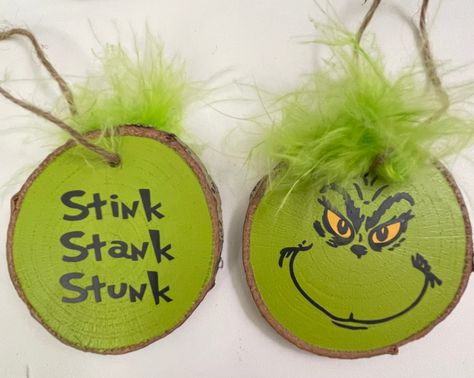 Double-sided Sealed Grinch Ornament on wooden rounds. Grinch Orderments Diy, Diy Wooden Grinch, Grinch Face Ornament, Christmas Ornaments With Bells, Wood Grinch Ornaments, Handmade Grinch Ornaments, Grinch Pizza Pan Wreath, Wooden Grinch Ornaments, Grinch Wood Ornaments