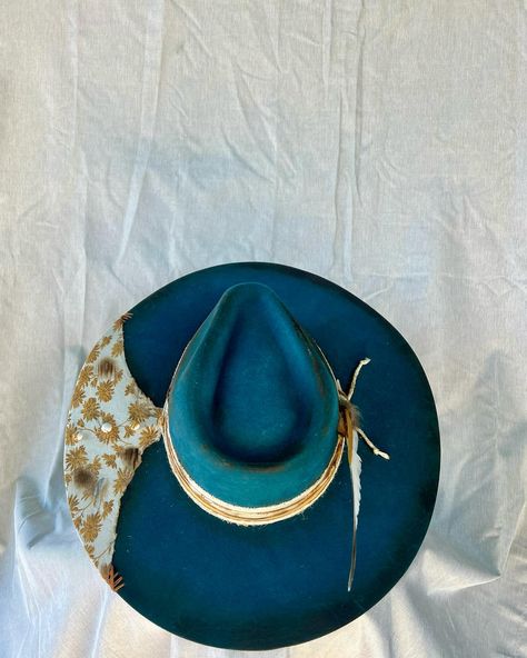 “Gypsy” Custom teal burned flat brim western hat adorned with hand sewn details, twine, buttons, multiple fabrics and feathers. Very good quality cashmere wool felt hat in a beautiful color. One of a kind. Size: 7 1/8 - 7 1/4 $250 https://theroguecowpoke.etsy.com/listing/1807959615 Western Hat, Western Hats, Felt Hat, Hats For Sale, Cashmere Wool, Custom Hats, Hand Sewn, Twine, Wool Felt