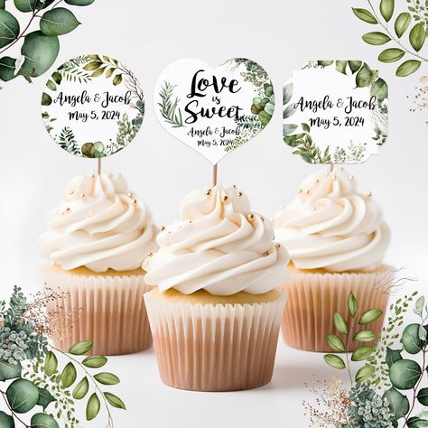 "Lovely watercolor images adorn these cupcake topper picks to add a personalized touch to your cupcakes at your event. Each topper is printed on heavy white cardstock and is attached to a natural wood pick. The layout, wording and colors on these toppers cannot be changed; only your personalization of name and date. .¸*This item is MADE-TO-ORDER; please order at least 3 weeks before your event to allow for production and delivery time within the USA. Larger orders may take longer and Rush orders may incur an additional fee. .¸ Please enter your name and event date in the personalization box so that we may be sure to have your items arrive in plenty of time for your event. Each cupcake topper measures 1.75\" by approximately 4.5\" tall including the natural wood stick. *You May Also Like th Wedding Cake Toppers, Wedding Cupcakes, Wedding Cupcake Toppers, Cupcake Picks, Wedding Leaves, Watercolor Images, Wedding Favor Tags, Cupcake Topper, Greenery Wedding