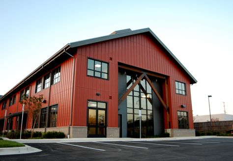 Board and Batten exterior finish with standing seam roof, commercial storefront and exposed wood structural elements create an Annapolis twist on a Pacific Northwest American look. This 2 story office building is set up to be for mix of Office and Retail end users. Modern Warehouse Design Exterior, Warehouse Aesthetic, Industrial Building Design, Commercial Steel Buildings, Pre Engineered Steel Buildings, Board And Batten Exterior, Metal Building Designs, Factory Architecture, Commercial And Office Architecture