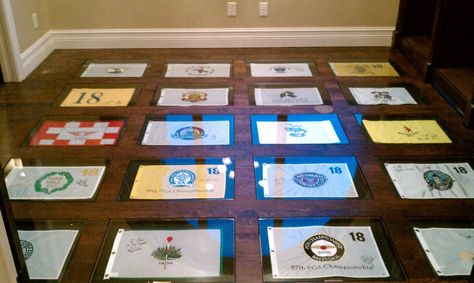 My dad ran out of wall space for his collection of golf pin flags, so I told him to put them under industrial-strength glass in the floor. We're pretty pleased with the results. Framed Golf Flag Display, Golf Flag Display Ideas, Golf Flag Display, Hunting Rooms, Flag Display Ideas, Sports Cave, Golf Flags, Golf Office, Golf House