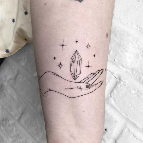 Hand-poked hand and crystal tattoo on the left arm Crystal Tattoos, Tiny Tattoos For Women, Gem Tattoo, Typography Tattoo, Astrology Tattoo, Crystal Tattoo, Hand Poked Tattoo, Tattoo Portfolio, Poke Tattoo