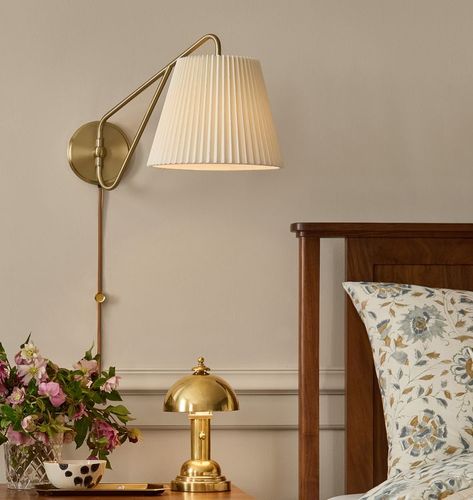 Inspired By French Lighting Designs, Eden Features A Slender Swing-Arm Paired With A Classic Smooth Or Pleated Linen Shade. Bed Side Lighting Ideas, Bedside Scones, Bed With Sconces, Light Sconces Bedroom, Bedroom Sconces Bedside, Nyc Rooms, French Lighting, Bed Lamp, Interior Design Resources