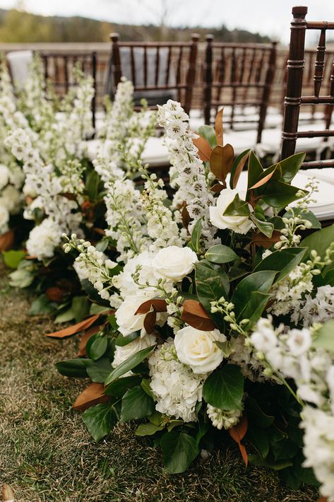 White rose, white hydrangea, white delphinium, magnolia ceremony aisle floral hedge Magnolia Wedding Decor, Fall White Bouquet, Magnolias Wedding, Magnolia And Hydrangea Wedding, Magnolia Floral Arrangements, Magnolia Wedding Flowers Centerpieces, Magnolia Flower Wedding, Magnolia Centerpiece Wedding, Magnolia Wedding Bouquet