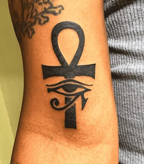 180 Excellent Ankh Tattoo Designs with Meanings (2022) - TattoosBoyGirl Ankh Arm Tattoo, Ankh Eye Tattoo, Ankh Eye Of Horus Tattoo, Ankh Tattoo Women Chest, Key Of Life Tattoo, Ankh Tattoo Women, Ankh Tattoo Design, Powerful Tattoos, Egyptian Eye Tattoos