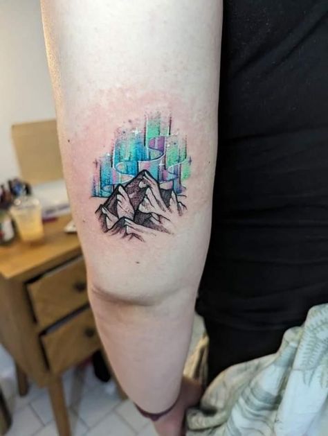 My Northern lights tattoo done by Kizzey at GetModified in Carlisle Aura Borealis Tattoo, Arctic Tattoo, Mountain Northern Lights Tattoo, Northern Lights Tattoos, Small Northern Lights Tattoo, Northern Lights Tattoo Sleeve, Aurora Borealis Tattoo Watercolor, Aurora Tattoo Northern Lights, Aurora Borealis Tattoo