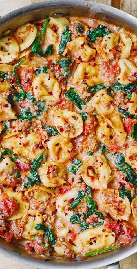 Creamy Tortellini with Sausage, Spinach, Tomatoes, and Mozzarella in a stainless steel skillet Tortellini With Sausage, Tortellini With Spinach, Mozzarella Cheese Sauce, Tomatoes And Mozzarella, Creamy Tortellini, Sausage Spinach, Spinach Tortellini, Sausage Tortellini, Tortellini Recipes