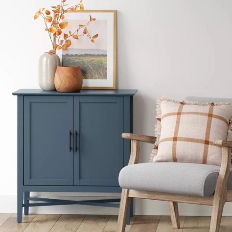 A blue storage cabinet that’ll seamlessly fit into any room. It has two internal shelves and a spacious tabletop so you can display all of your favorite belongings. Small Storage Cabinet Living Room, Small Entry Cabinet, Small Cabinet Styling, Narrow Entry Cabinet, Small Dining Room Storage Cabinet, Small Cabinet Decor, Hallway Cabinet Ideas, Small Cabinet Ideas, Entryway Cabinet Ideas