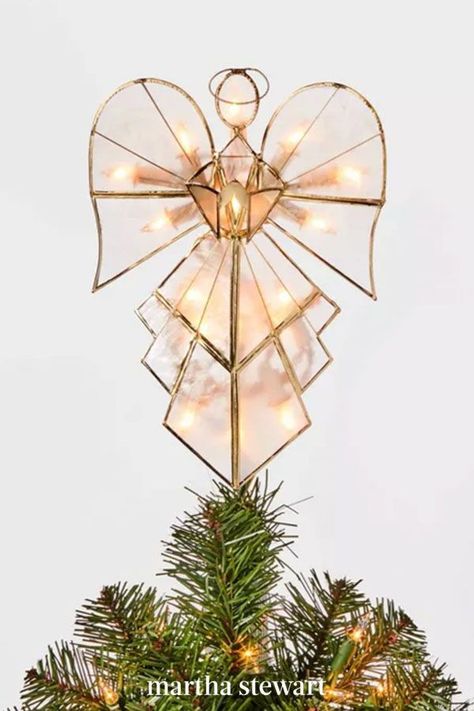 An angel earns her wings as the topper of any Christmas tree. This modern topper—with 16 white lights—adds even more excitement to your holiday display. It's composed of clear capiz shells framed inside a gold metal trim for pretty ornamental flair. #christmas #holidayideas #christmasideas #wintertodo #marthastewart Light Up Angel Tree Topper, Modern Angel Tree Topper, Glass Angel Tree Topper, Christmas Tree Toppers Angel, Angels Christmas Tree, Stained Glass Angel Tree Topper, Angel On Christmas Tree, Cross Tree Topper, Diy Angel Topper For Christmas Tree