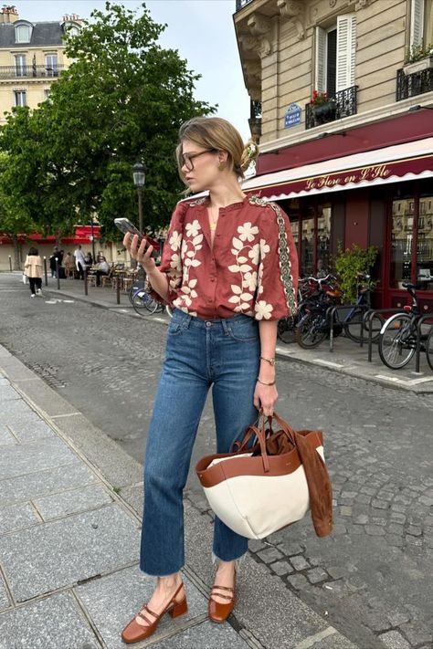 @elodieromy wearing the Sézane Anton Floral Embroidery Blouse. Sézane in spring is iconic for shirts and blouses, offering florals, embroidery, and beautiful bright colors, as well as monochrome neutrals. Sézane is the place to find all your whimsical shirts for the spring. Denim Blouse Outfits, Vintage Blouse Outfit, Paris Fashion Summer, Floral Blouse Outfit, Floral Shirt Outfit, Floral Embroidery Blouse, Parisian Style Outfit, French Outfits, Parisian Wardrobe