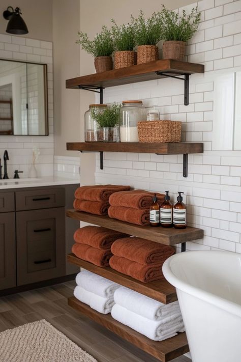 If your bathroom is in need of an upgrade but you don't want a full remodel, then check out these bathroom decor tips that can transform your space. Modern Cozy Bathroom Ideas, Bathroom Decor Dark Wood, Nature Bathroom Aesthetic, Plant Bathroom Aesthetic, Cozy Bathroom Aesthetic, Warm Tone Bathroom, Cozy Bathroom Decor, Small Rustic Bathroom, Bathroom Floating Shelves