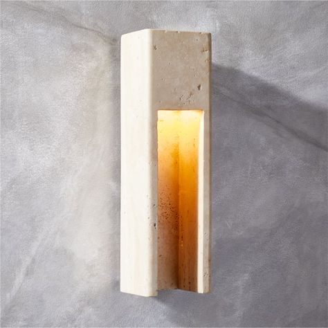 Studio Anansi's indoor/outdoor wall sconce is carved from a single piece of travertine for a clean, uncomplicated design that softly scatters light. Lightly polished to unify its tone, each sconce will have subtle differences that render it uniquely beautiful. CB2 exclusive.  -Designed by Studio Anansi -Travertine -Polished stainless steel canopy -Variation in color and activity of travertine is to be expected; each will be unique -Indoor/outdoor -Accommodates one 40W E12 bulb or 5W LED bulb not Travertine Wall, Wall Scone, Steel Canopy, Modern Outdoor Lighting, Exterior Wall Light, Outdoor Sconces, Modern Wall Sconces, White Concrete, Modern Light Fixtures