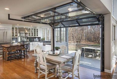 the dining space is opened to the deck with the help of garage doors Glass Garage, Glass Garage Door, Garage Remodel, Hanging Ideas, Garage Interior, Industrial Kitchen, Pole Barn Homes, Garage Design, Open Kitchen