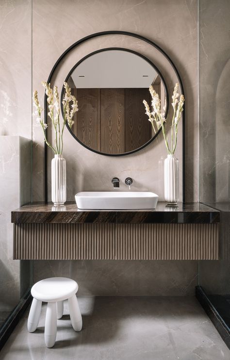 This Mumbai apartment revels in a sense of space as well as intimacy | Architectural Digest India Rounded Vanity, Washroom Vanity, Mumbai Apartment, Powder Bathroom, Modern Bathroom Tile, Bathroom Vanity Designs, Washbasin Design, Washroom Design, Basin Design