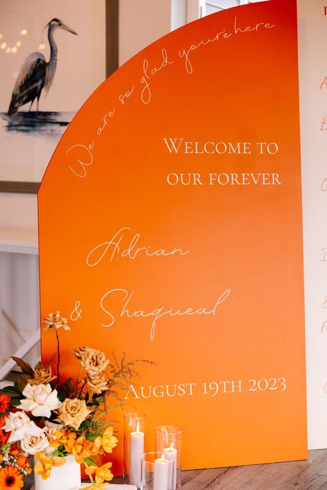 Love this orange toned arch welcoem sign - what a colourful impact and statement to welcome guests! Photography 📸 Love and Other Photography Wedding Welcome Sign Colorful, Colourful Wedding Welcome Sign, Colorful Welcome Sign, Orange Signage, Orange Wedding Signage, Orange Welcome Sign, Pink And Orange Seating Chart, Arch Welcome Sign, Bramleigh Estate