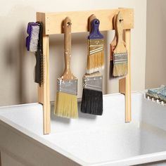 Paint brush drying rack for the utility sink Portable Workbench, Stripping Furniture, The Family Handyman, Shop Vacuum, Clear Plastic Containers, Workshop Organization, Family Handyman, Wooden Projects, Workshop Storage