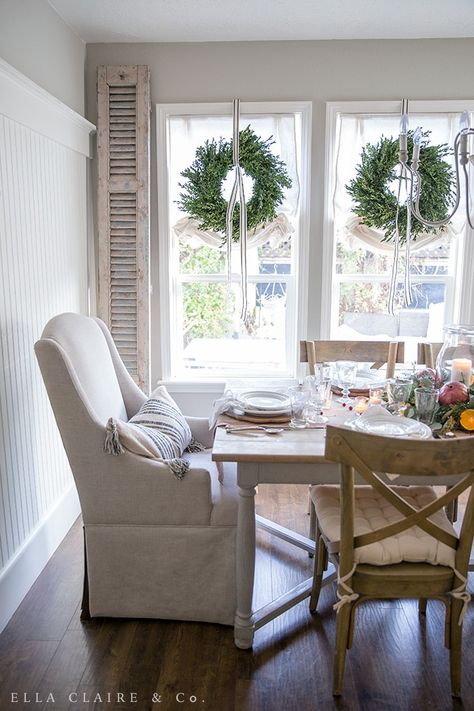 fresh Boxwood wreaths hung with ribbon in these dining room windows add Christmas charm to this farmhouse inspired space. Mandala Underboob Tattoo Design, Christmas Oranges, Tablescape Christmas, Christmas Wreaths For Windows, Diy Centerpiece, Window Wreath, Dining Room Windows, Underboob Tattoo, Indoor Window