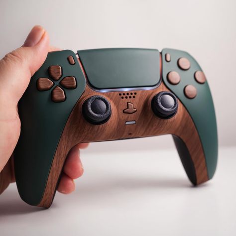 Some more earth tones. #ps5games #ps5controller #ps5 #playstation5 #playstation5games #playstation5controller #ps #ps4 #ps2 #earthtones #cozygaming Nature Themed Gaming Setup, Ps4 Custom Controller, Pc Game Room, Cool Game Room Ideas, Game Controller Storage, Ps5 Setup, Custom Ps5 Controller, Nerdy Decor, Nerd Decor