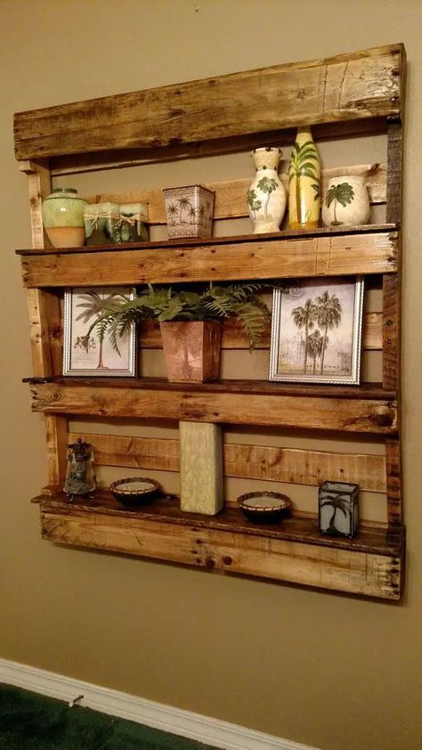 a large rustic pallet shelf stained, with photos, vases and candles on display for a rustic or vintage rustic space Floating Shelves Pallet Wood, Pallet Board Shelves, Pallet Shelving Ideas, Pallet Shelves Diy Wall Shelves, Wall Pallet Ideas, Pallet Floating Shelves, Pallet Board Projects, Shelves Made From Pallets, Pallet Bathroom Ideas