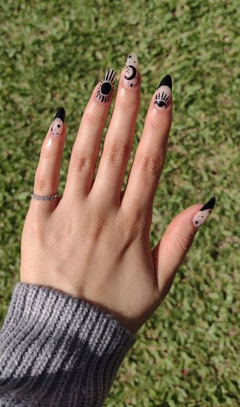 The best witchy nails for a grunge look Almond Shaped Black Nails Designs, Rave Nails Designs Short, Boho Black Nails, Nude Witchy Nails, Celestial Almond Nails, Funky Black Nails, Nail Art Dark Colors, Witchy Nails Black, Minimalist Nail Art Almond