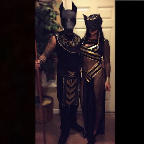 Couple Halloween costumes. Anubis and Bastet. Paper masks from Etsy. Egyptian Group Costume, Mummy Couple Costume Halloween, Anubis Halloween Costume, Egyptian Family Costumes, Egyptian Halloween Costume Couples, Cleopatra Halloween Costume Couple, Bastet Goddess Costume, Egyptian Couple Costume, Egyptian God Costume