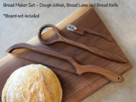 Walnut Bread Maker Set! The set includes a dough whisk, bread lame and bread knife! The dough whisk to mix your dough, the bread lame, to scoring a beautiful design on dough before you bake, and the bread knife, to get those perfect slices. These three items will make a great addition to your kitchen or would make a great gift for a baker! For the dough whisk, you can choose either a one hole or a two hole whisk. For the bread lame, it comes with a stainless steel blade installed and 5 extra blades For the bread knife, you can choose from either a left handed or a right handed bread knife All our products are sanded smooth and finished with a food safe finish (mineral oil and beeswax). DIMENSIONS (irregular shape) Dough Whisk - 13" x 3" x 5/8" Bread Lame - 5-1/2" x 1-3/16" x 1/4" Bread Kni Apartment Homestead, Dough Whisk, Bread Lame, Danish Dough, Wooden Cooking Utensils, Cnc Ideas, Dream Ideas, Cooking Gift, Walnut Bread