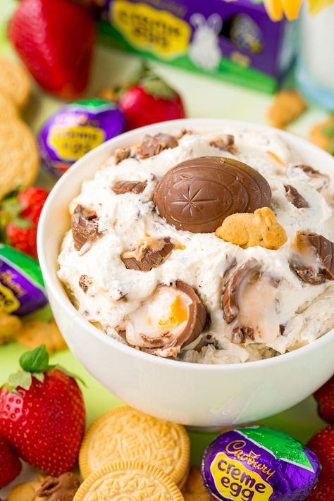 Cadbury Creme Egg Dip has a 4-ingredient creamy dip base that's then loaded with chopped-up pieces of sweet Cadbury creme eggs! Serve this dessert dip up to friends and family in just 10 minutes! Cadberry Egg Dip, Cadbury Dip, Creme Egg Dessert, Mini Egg Dip, Cadbury Cream Egg, Easter Dessert Dip, Cadbury Egg Desserts, Cadbury Egg Dip, Cadbury Creme Egg Dip