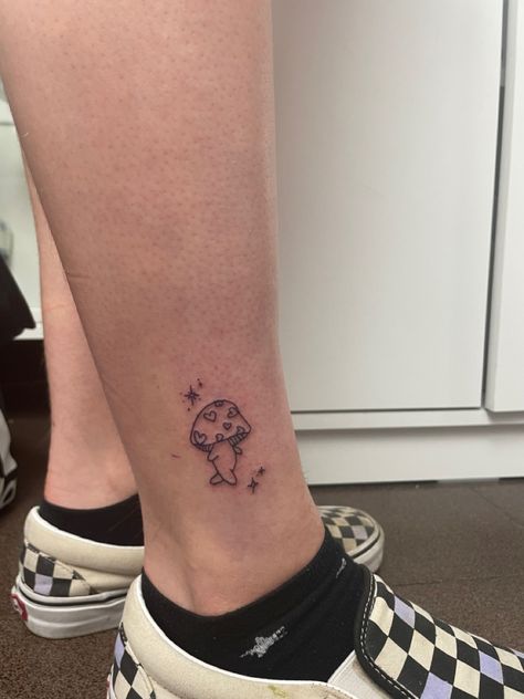 Cute Walking Mushroom Tattoo🍄 ig:percsydori Dancing Mushroom Tattoo, Mushroom Tattoo Placement, Walking Mushroom Tattoo, Small Whimsical Tattoos, Mini Mushroom Tattoo, Little Mushroom Tattoo, Tiny Mushroom Tattoo, Cute Mushroom Tattoo, Small Mushroom Tattoo