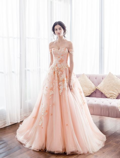 Sweet, feminine, romantic, and refreshing, peach has become one of the hottest trends in recent weddings! The color is a sophisticated blend of both contemporary and classic elegance, making peach dresses a great alternative for traditional gowns. Its soft touch and dreamy tone are perfect for graceful brides. Here are some of our favorite gowns in peach, let’s dive in! Peach Gowns, Peach Wedding Dress, Peach Dresses, Debut Gowns, Peach Gown, Traditional Gowns, Feminine Romantic, Peach Dress, Pink Gowns