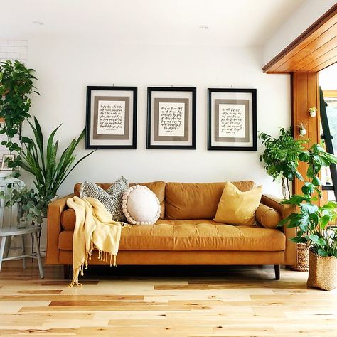 Tour this Eclectic, Mid-Century Home in Toronto Bathed in Natural Light | dress your home Mcm Plants, Living Room Decor Eclectic, Tan Sofa, Sofa Santai, Yellow Couch, Photos Wall, Yellow Sofa, Uo Home, Yellow Living Room