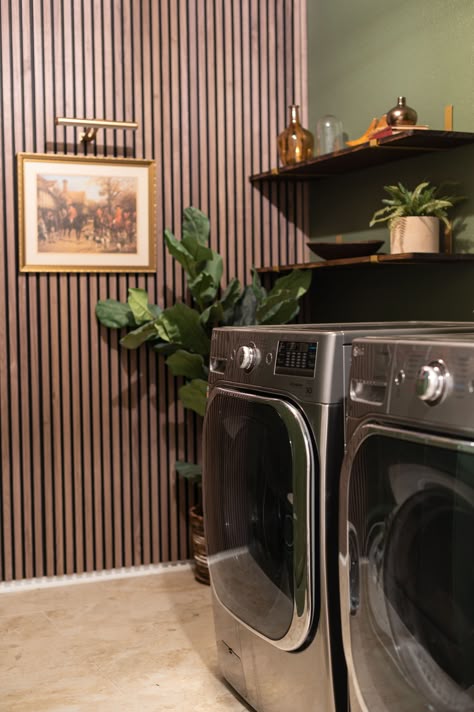 Elevating my laundry room aesthetic with a touch of contemporary design, with this sleek walnut slat wall from @thewoodveneerhub. I love how it creates a striking focal point in this makeover! I may actually enjoy doing laundry now! Wood Slat Wall Laundry Room, Wood Paneling Laundry Room, Green And Brown Laundry Room, Laundry Room Ideas Shiplap, Laundry Room Wood Paneling, Slat Wall Laundry Room, Wood Panel Laundry Room, Slat Wainscoting, Slat Wall Bathroom