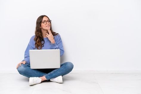 Photo young caucasian woman with a lapto... | Premium Photo #Freepik #photo #student-laptop #student-computer #student-sitting #caucasian Hands To The Side, Woman With Laptop, Psd Icon, On The Floor, Vector Photo, Premium Photo, The Floor, Looking Up, White Background