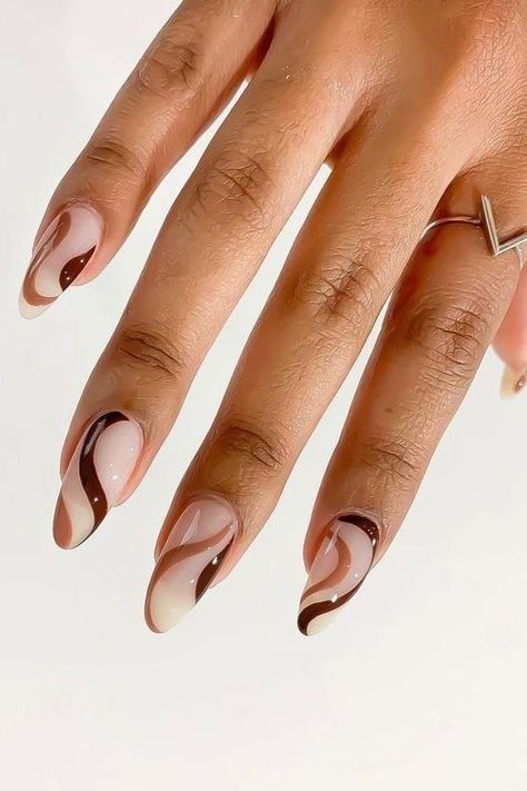 Looking for gorgeous brown nails? Check out these acrylic brown nails and brown nail designs Brown Nails Abstract, Brown Acrylic Nails Design Almond, Brown Nail Almond, Almond Nails Abstract Designs, Nail Design For Almond Shaped Nails, Brown Nails Ideas Almond, Brown Nail Art Ideas, Almond Shapes Nail Designs, Brown Nail Aesthetic