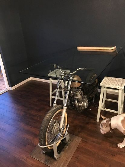 the motorcycle dining room table Motorcycle Garage Ideas, Car Part Furniture, Motorcycle Decor, Motorcycle Shop, Motorcycle Garage, Cafe Racer Build, Man Cave Home Bar, Automotive Decor, Diy Upcycling