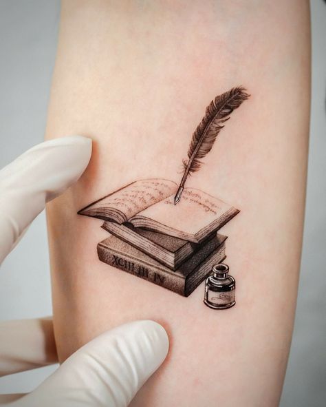 101 Best Stack of Books Tattoo Ideas That Will Blow Your Mind! 9 Outsons Author Tattoo, Open Book Tattoo, Writer Tattoo, Quill Tattoo, Book Inspired Tattoos, Reading Tattoo, Book Lover Tattoo, Book Tattoos, Bookish Tattoos