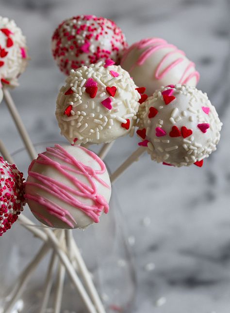 Strawberry Cheesecake Cake Pop Recipe - Inspired by This Cheesecake Cake Pops, Strawberry Cheesecake Cake, Perfect Cake Pops, Flower Cake Pops, Rose Cake Pops, Strawberry Cake Pops, Cake Pop Bouquet, Valentine Cake Pop, Cheesecake Pops