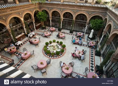 Courtyard, Hotel Alfonso XIII, Seville, Spain Stock Photo Maroco Style, Arabian House Design, Exterior Dining, Hall Construction, Arabian Nights Aesthetic, Courtyard Restaurant, Seville Hotel, Kit Net, Courtyard Hotel