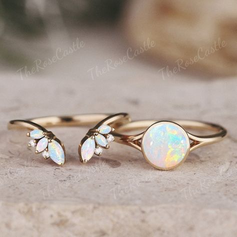 Unique Round Opal Engagement Ring Set Vintage Rainbow Opal Ring Art Deco Round Moissanite Diamond Gold Rings Opal Bridal Set Gift For Her ITEM DETAILS ●Available in yellow, white or rose solid 10k, 14k or 18k gold. This ring can be made in Platinum or sterling silver. ❀❀Center Stone: Natural opal Shape: Round shape Size: 6.5mm Band width: Around 1.5mm ❀❀Open wedding band Stones: Natural opal & Moissanite / Natural Diamond Shape: Marquise & Round shape Moissanite / Diamond Weight: About 0.01ct Cl Opal And Silver Engagement Ring, Opal And Moissanite Engagement Ring, Dainty Opal Wedding Ring, Matching Opal Wedding Rings, Pink Tourmaline And Opal Engagement Ring, Opal Engagement Ring With Wedding Band, Gender Neutral Rings, Opal And Gold Ring, Non Traditional Engagement Rings Opal