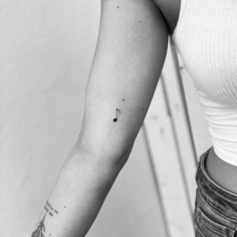 Minimalist music note tattoo on the inner arm Ear Tattoo Inner Music Notes, Quarter Note Tattoo, Music Note Tattoo Ankle, Music Key Tattoo, Dainty Music Note Tattoo, Tiny Music Note Tattoo, Fine Line Music Note Tattoo, Fineline Music Tattoo, Small Music Tattoos Unique