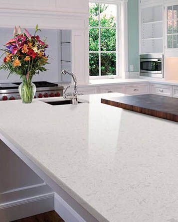 Glacier White Quartz is a sparkling, milk-white polished quartz faintly clouded with frosty heather. Featuring a time-honored combination of white and muted gray, it’s beautiful in any number of settings and themes whether used on countertops, walls, backsplashes, or floors. Small Kitchen Decoration, White Quartz Countertops, Travertine Pool Coping, Quartz Kitchen Countertops, Bathtub Remodel, Quartz Kitchen, Countertop Design, White Quartz Countertop, White Granite