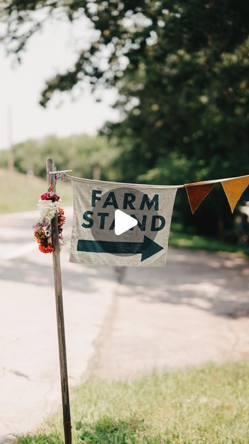 Ali & Scott Yahnke on Instagram: "✨ Weather-proof, naturally ✨

Comment ~ FLAGS ~ and we’ll send you a link to our tutorial that you can download for free! 

Our tutorial includes a list of materials and their USA-made source, plus a step by step guide on how to make your own banner to suit your needs.

We’ve made many flag banners over the years of having a farm stand. We’ve finally found the perfect materials that could withstand exposure to the elements while also fitting our farm stand vibe of cozy and natural. 

I hope this tutorial will save you some of the trial and error we’ve gone through and help you create something that fits your needs, for a farm stand, or just for fun! 
.
#handmade #diy #diycrafts #flagbanner #flags #farmstand #makeiteasy #makeitnice #homesteadlife" Farm Stand Display Ideas, Things To Sell At Farm Stand, Diy Farm Stand On Wheels, Farm Stand Ideas Diy Projects, Diy Farm Stand How To Build, Honor System Farm Stand, Diy Farmstand, Diy Roadside Farm Stand, Roadside Farm Stand Ideas