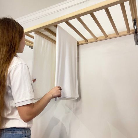 Our Wall Mounted Clothes Drying Rack offers a practical and efficient solution for drying laundry. Crafted from high-quality wood, this foldable design saves space while adding a touch of style to your home. Efficient and Space-Saving: Save money and floor space with our innovative drying rack. Hang wet clothes over the laths and raise them near the ceiling using the pulley system for quick and efficient drying. Customizable and Stylish: Tailor-made to fit your space, our drying rack comes in va Wall Mounted Clothes Dryer, Drying Laundry, Wall Mounted Clothes Drying Rack, Hanging Drying Rack, Wall Mounted Drying Rack, Hidden Laundry, Laundry Rack, Pulley System, Drying Rack Laundry