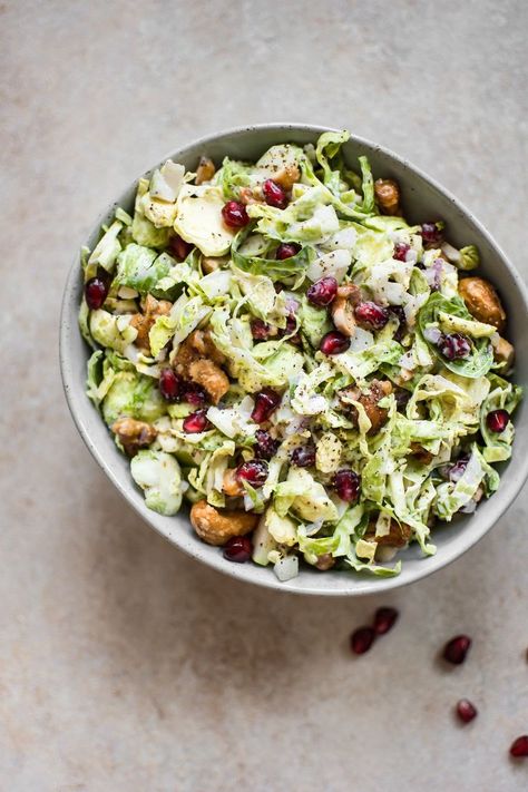 This winter Brussels sprouts slaw is loaded with goodies like candied cashews and pomegranate arils. A gorgeous side dish perfect for the holidays! Brussels Sprouts Slaw Recipe, Candied Cashews, Salt Lavender, Shredded Brussel Sprouts, Grilled Eggplant, Vegan Side Dishes, Slaw Recipes, Granny Smith, Brussels Sprouts