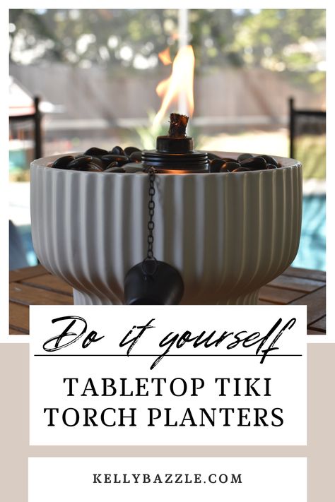 These tiki torch planters are so easy to make and they will immediately level up your outdoor space. You can purchase all of the items from Walmart and create a unique fire bowl for less than those other pre-made tabletop tiki torches. Tap this pin to get the links to everything you need to make your own. Patio Torches Ideas, Diy Tiki Torches, Patio Tiki Torch Ideas, Tiki Torch Centerpiece Ideas, Tiki Torch Planter Ideas, Tiki Torches On Deck, Outdoor Tiki Torch Ideas, Outdoor Centerpieces Patio, Outdoor Tabletop Decor