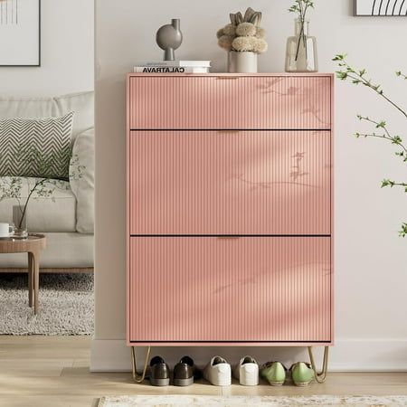 This pink diamond-shaped shoe cabinet is full of fashion in appearance. The simple and elegant color, exquisite metal legs, and luxurious golden metal handles all add a high-end atmosphere to this shoe cabinet, making it easy to adapt to any decoration style.Rotating flip drawers avoid the shortcomings of traditional push-pull drawers, are better dust-proof and have larger capacity. Shoe Organizer For Small Closet, Slim Entryway Cabinet, End Cabinet Ideas, Cute Shoe Storage, Pink Closet Aesthetic, Condo Storage, Shoe Bins, Entryway Shoes, Shoe Organization Small Space