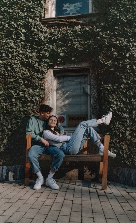 couple sitting on a bench Couples Photoshoot Bench, Bench Couple Pictures, Couples Sitting On A Bench, Bench Photography Poses Couple, Bench Poses Couple, Sitting Poses For Couples Photoshoot, Couple Silly Photoshoot, Photo Poses For Couples Travel, Couple Poses On Bench