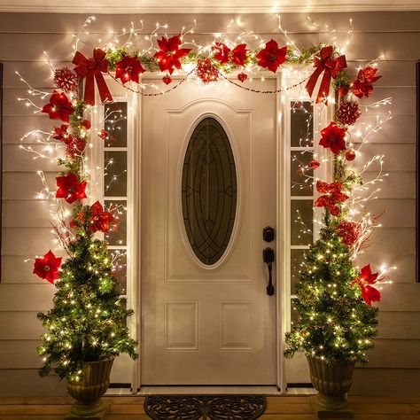 Christmas Door Decorating Ideas - Beautiful Christmas decorations for the porch created using lighted branches and red poinsettias! Diy Christmas Door Decorations, Diy Christmas Door, Christmas Door Decoration, Diy Christmas Lights, Door Decorating Contest, Cheap Christmas Diy, Front Door Christmas Decorations, Lighted Branches, Door Decorating