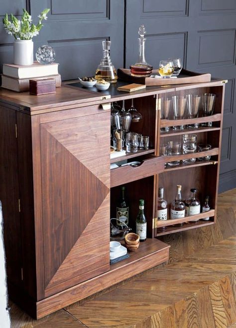 We’ve scoured the Internet and found some of the chicest bar cabinets around. Whether you fit them inside your finished basement, dining room, or a hosting area that you’re lucky enough to have a part of your open kitchen, these designs will have you planning extra dinner parties by the weekend. And don’t worry, there […] The post 15 Bar Cabinets That Will Have You Planning Dinner Parties By The Weekend appeared first on Trendir. Small Bar Cabinet, Bar Furniture For Sale, Bar Cabinet Design, Home Bar Cabinet, Bar Cabinets, Bar In Casa, Modern Home Bar, Home Bar Design, Diy Home Bar